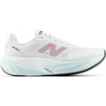 New Balance FuelCell Rebel v5 women's running shoe in White / Pink Heat / Glint Blue — outer view showing white engineered mesh upper with pink heat and glint blue accent detailing and FuelCell foam midsole profile