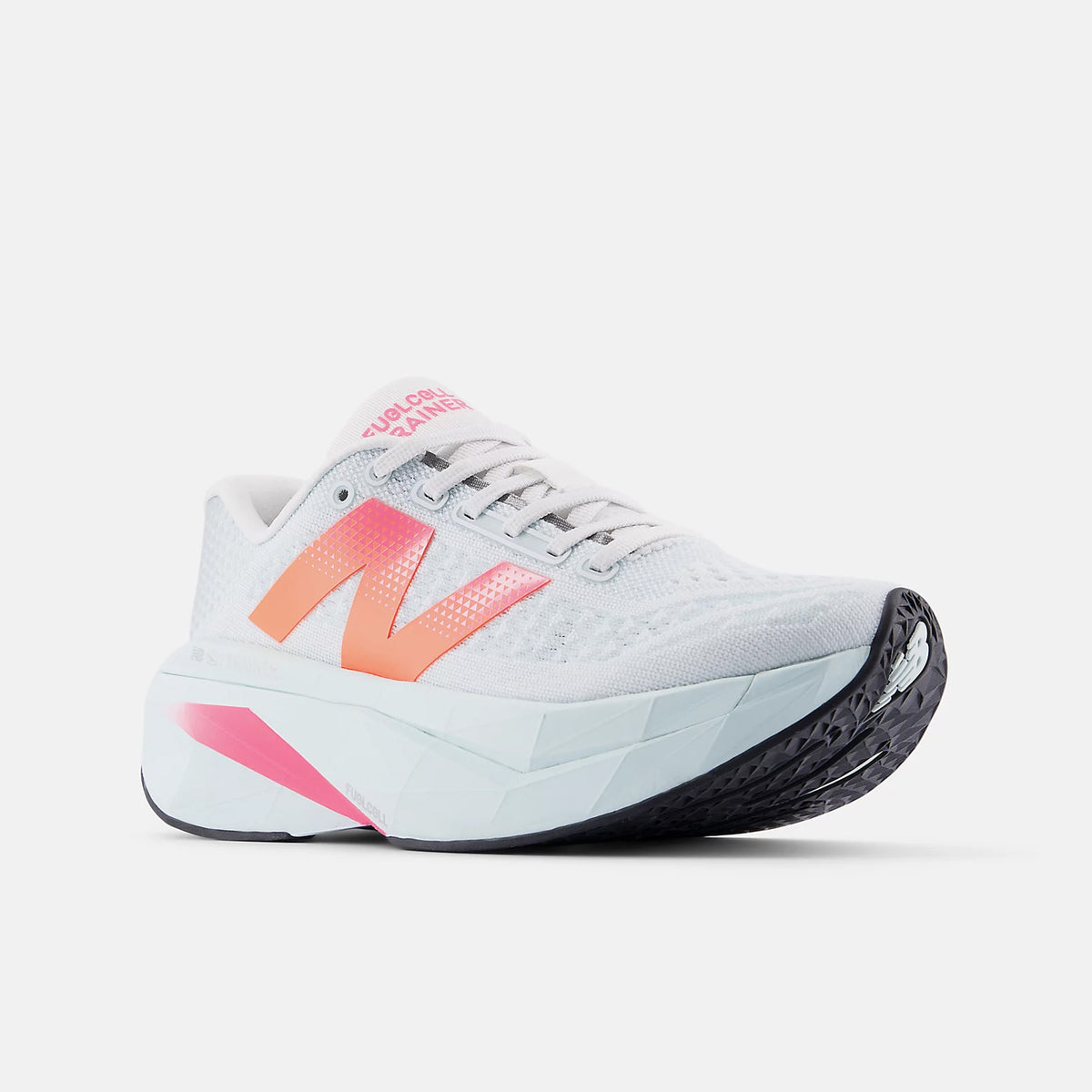 New Balance FuelCell SuperComp Trainer v3 women's running shoe in Glint Blue / Daybreak — angled view showing heel construction, Energy Arc carbon fibre plate profile and glint blue upper with daybreak midsole contrast