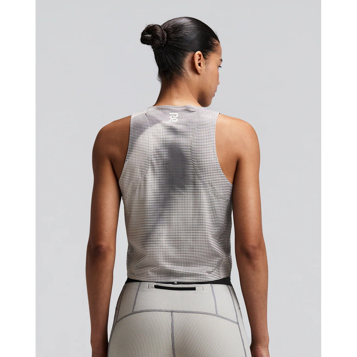 Women's Bandit GeoMesh Race Singlet Slate Plaster back view on female runner showing bonded armhole and body seam finishing with GeoMesh moisture-wicking construction for comfortable racing