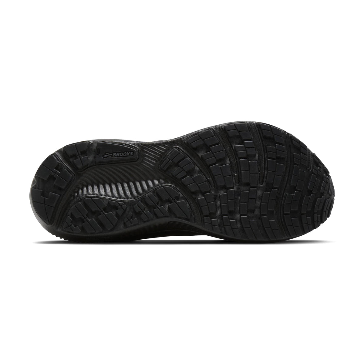 The image displays the black rubber outsole of the Brooks Women’s Ghost 18 GORE-TEX Running Shoes in Black/Black/Ebony, showcasing a textured pattern designed for enhanced traction and durability—perfect for those in need of waterproof running shoes and a dependable daily trainer.