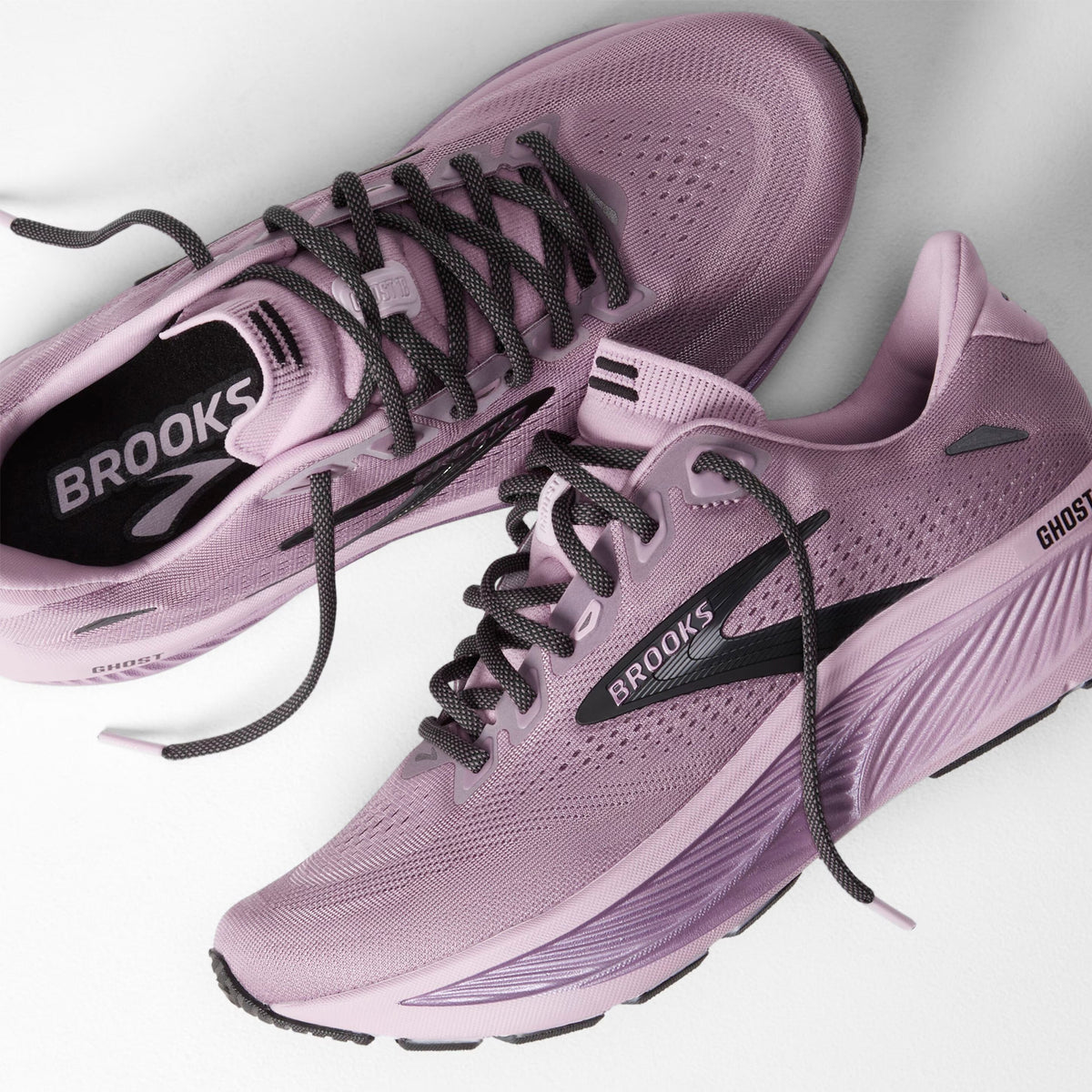 Brooks Ghost 18 women's running shoe in Elderberry / Black — angled side view showing elderberry engineered mesh upper, smooth midfoot transition and black DNA LOFT v2 cushioning midsole stack