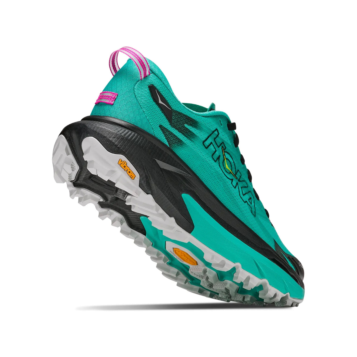 A teal and black running shoe with a rugged white sole, yellow Vibram logo, pink accent on heel, and HOKA branding on the side, shown from a low rear angle against a white background.