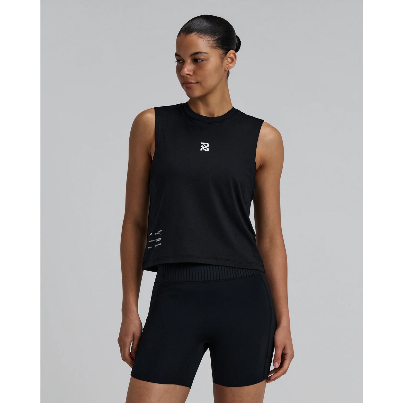 Bandit Micromesh Run Tank women's in Black — front view worn on model showing relaxed sleeveless fit, crew neckline, Micromesh™ fabric drape and reflective logo detail at centre front