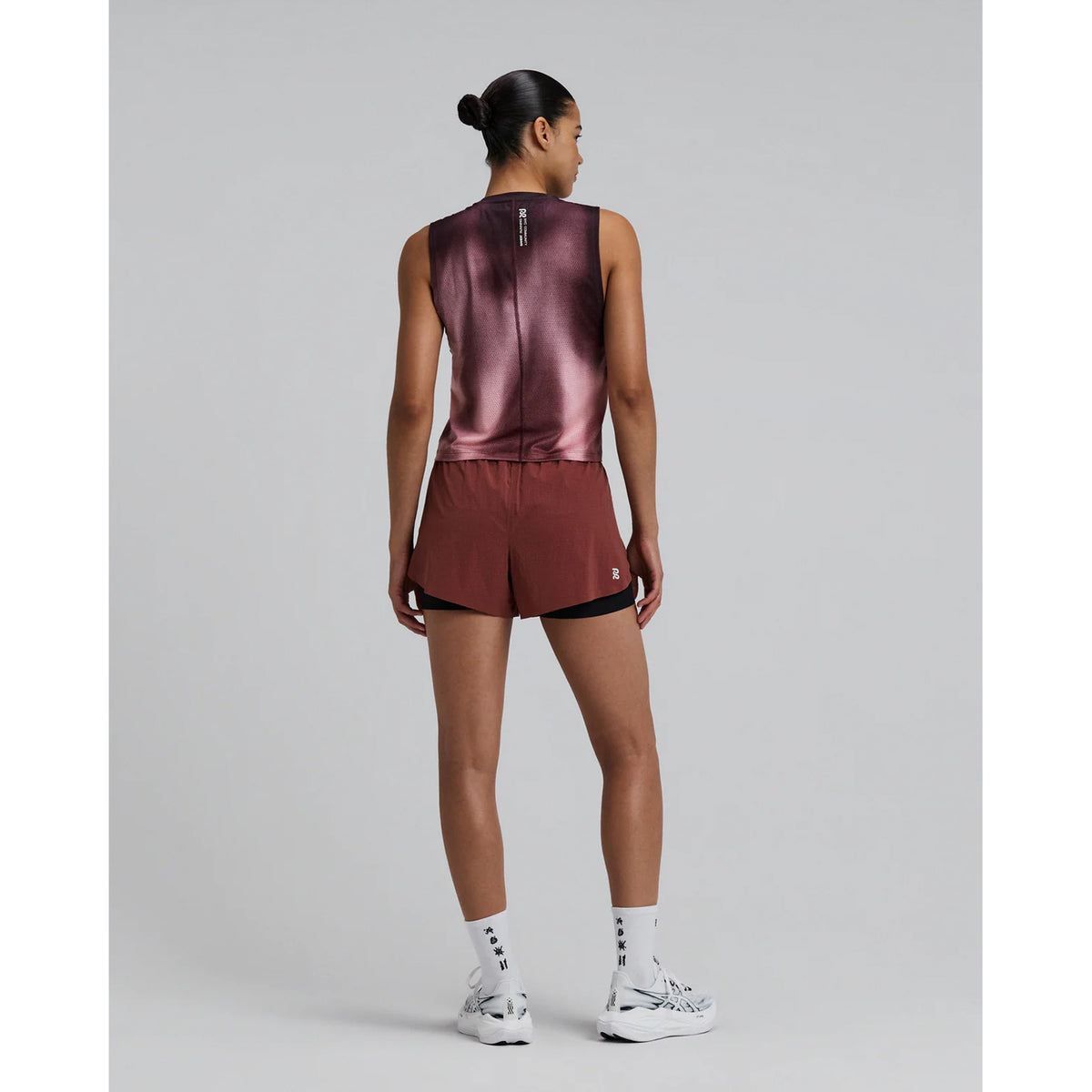 Women's Bandit Micromesh Run Tank Flow State Mahogany Multi full body back view on female runner showing breathable Micromesh fabric with flatlock seam and reflective logo