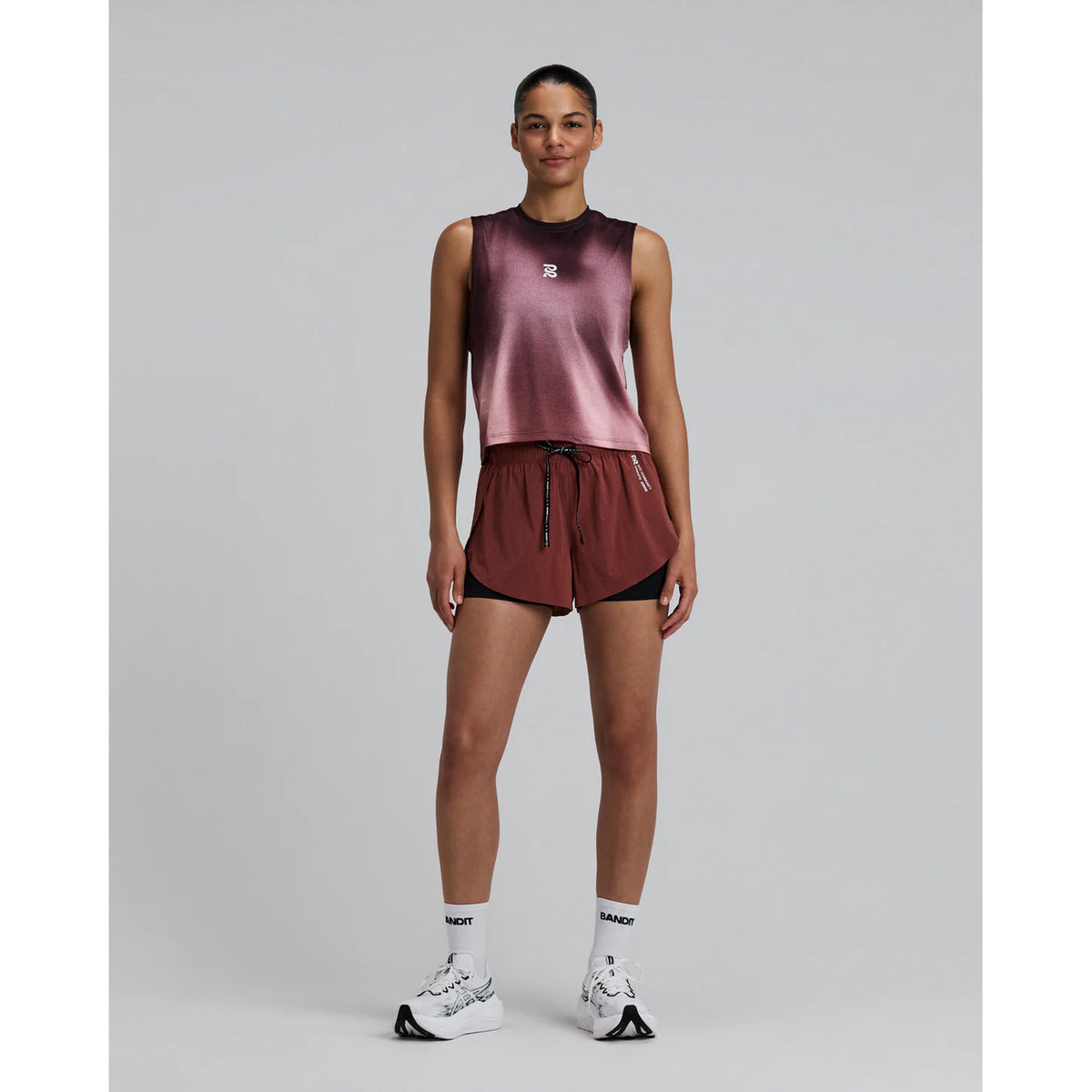 Women's Bandit Micromesh Run Tank Flow State Mahogany Multi full body front view on female runner showing sleeveless relaxed fit with moisture-wicking construction