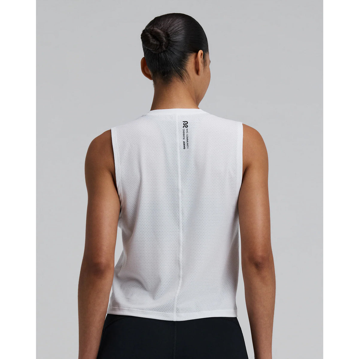 Bandit Micromesh Run Tank women's in White — back view worn on model showing relaxed sleeveless silhouette, flatlock seam at centre back and Micromesh™ breathable fabric construction
