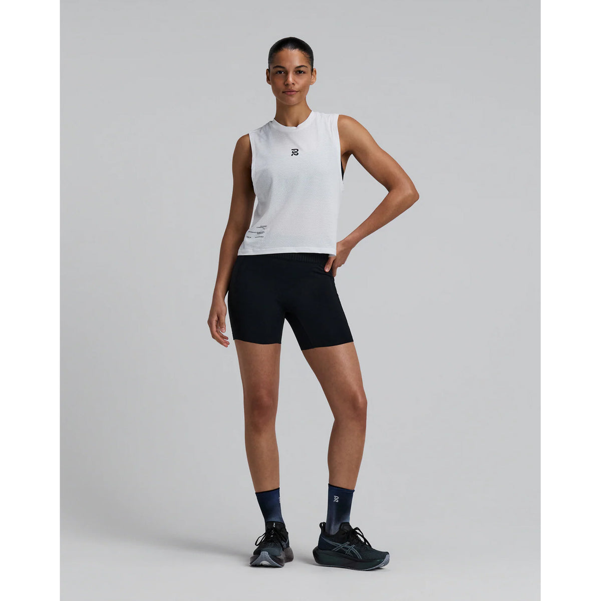 Bandit Micromesh Run Tank women's in White — full body front view worn on model showing sleeveless relaxed silhouette, crew neckline, Micromesh™ fabric drape and reflective logo detail at centre front