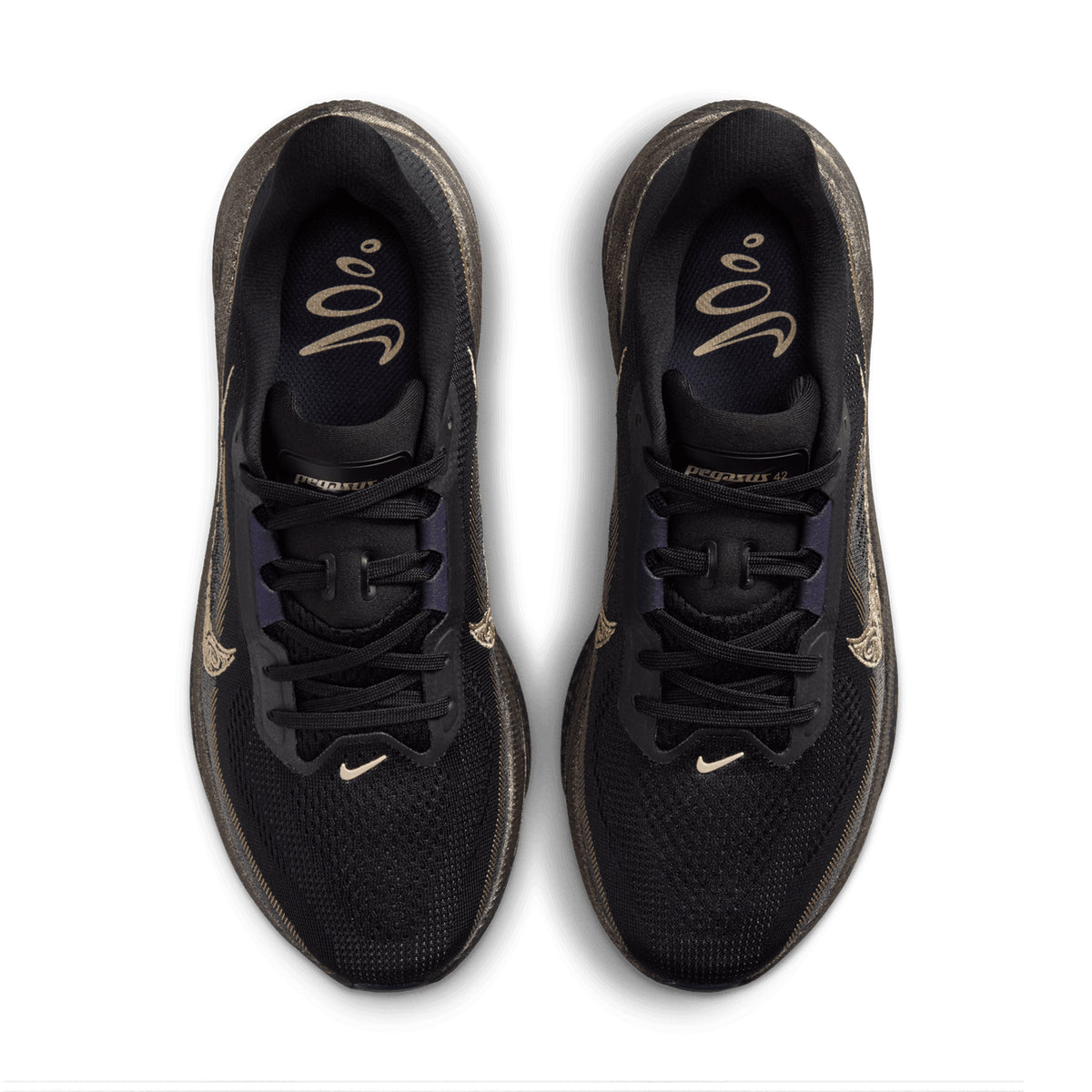 A top view of the Nike Women’s Pegasus 42 Keely Hodgkinson Running Shoes in Black, Pitch Blue, Blackened Blue, and Blur shows the pair placed side by side on a white background. The shoes feature subtle gold details, including small Swoosh logos and “Pegasus 42” on the tongue. Engineered with advanced Air Zoom cushioning inspired by elite athlete Keely Hodgkinson, this model represents Nike’s ongoing commitment to innovation in women’s running footwear.