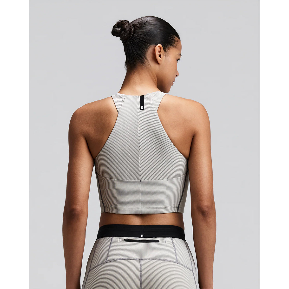 Women's Bandit Striped Cadence Zip Front Race Crop Plaster Slate back view on female runner showing angular racer back with silicone centre back patch and smooth anti-chafe seam construction