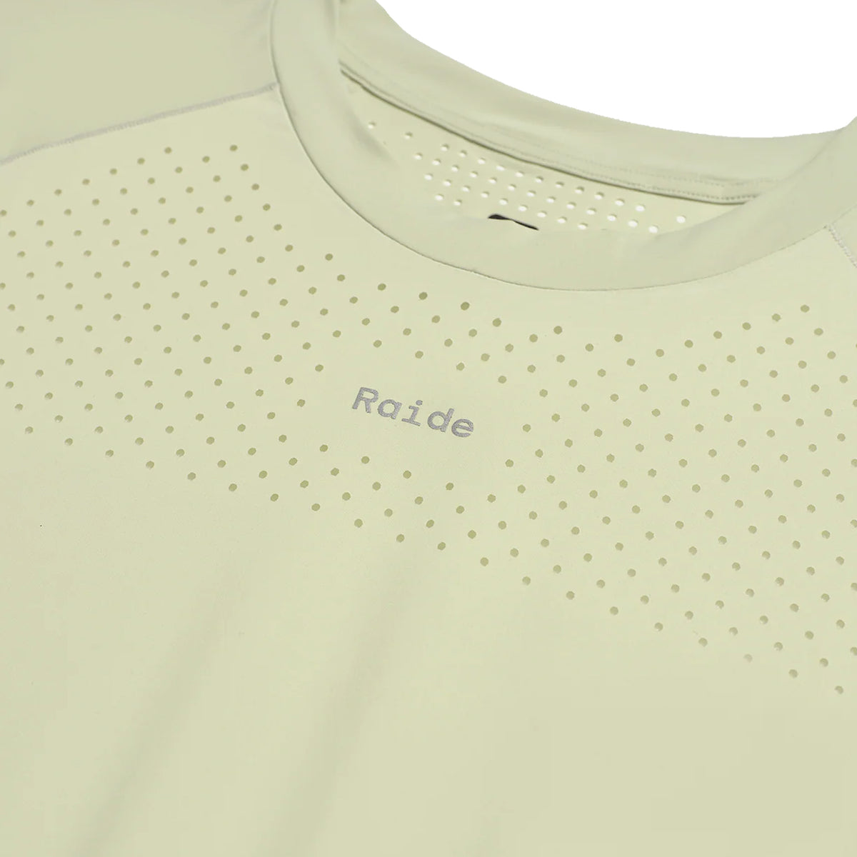 Women's Raide Thermal Dispersion Tee Lichen close-up of front showing reflective Raide branding with body-mapped laser-cut perforations and cool-to-touch 115gsm Italian-knit microfibre construction