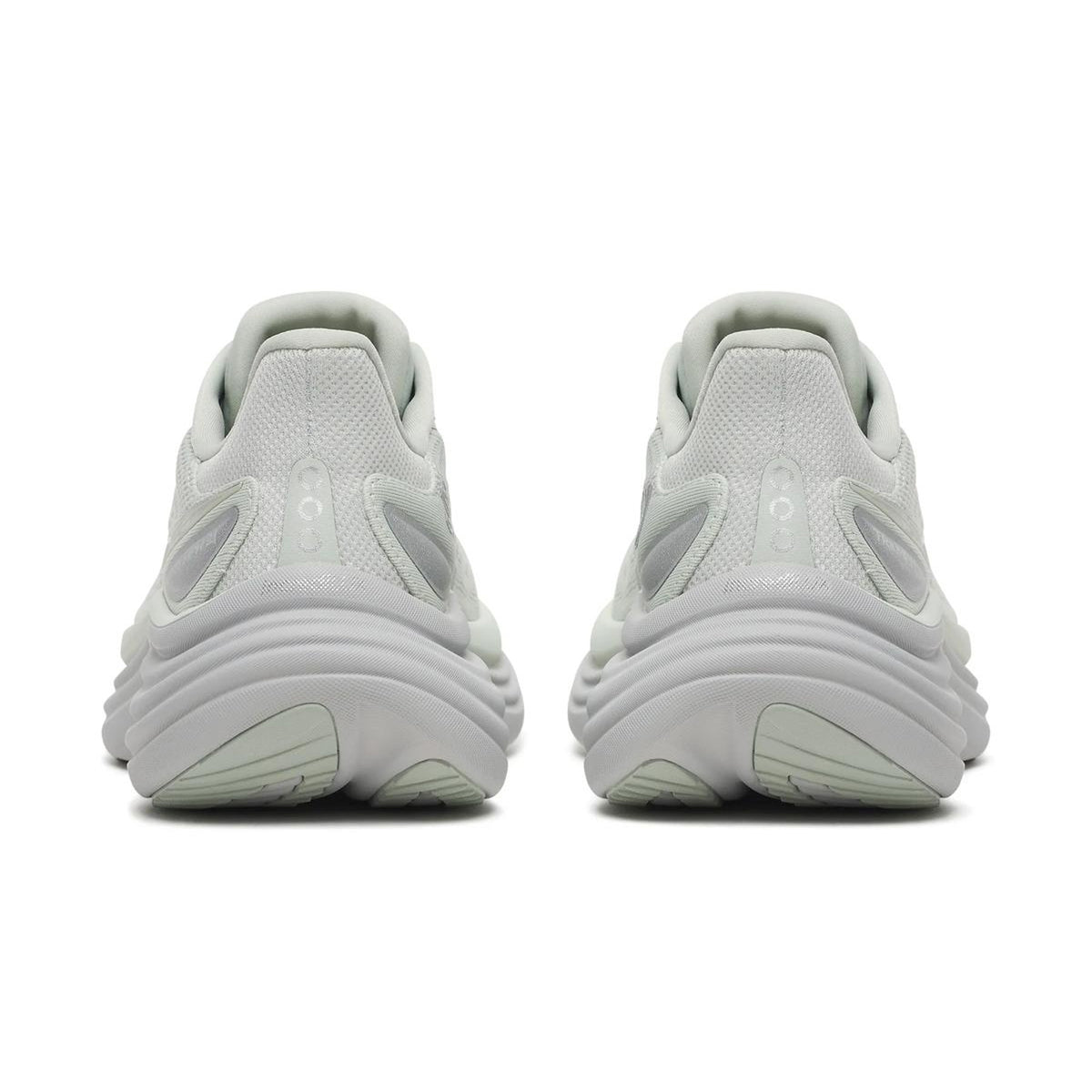 A pair of Women’s Triumph 24 Running Shoes Cast in white, equipped with incrediLUX foam for premium cushioning, are displayed from the back to showcase their distinctive heel and sole designs. The sneakers are placed side by side on a plain white background.