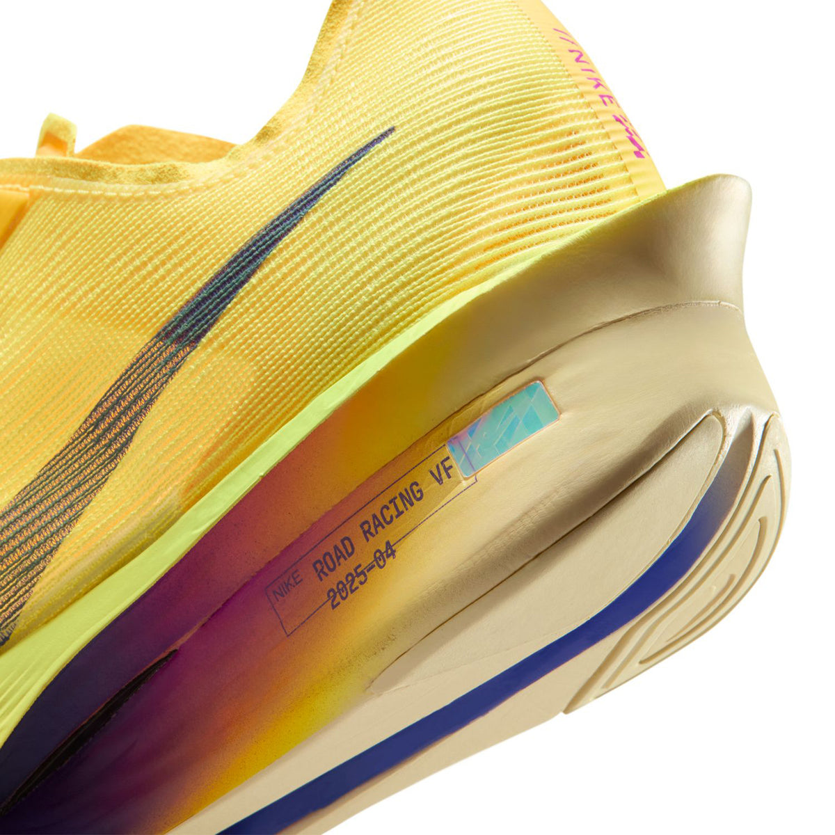 Women's Vaporfly 4 Running Shoes Citron Pulse Laser Orange Volt Ice Indigo Burst angled close-up heel view showing ZoomX cushioning and Flyplate