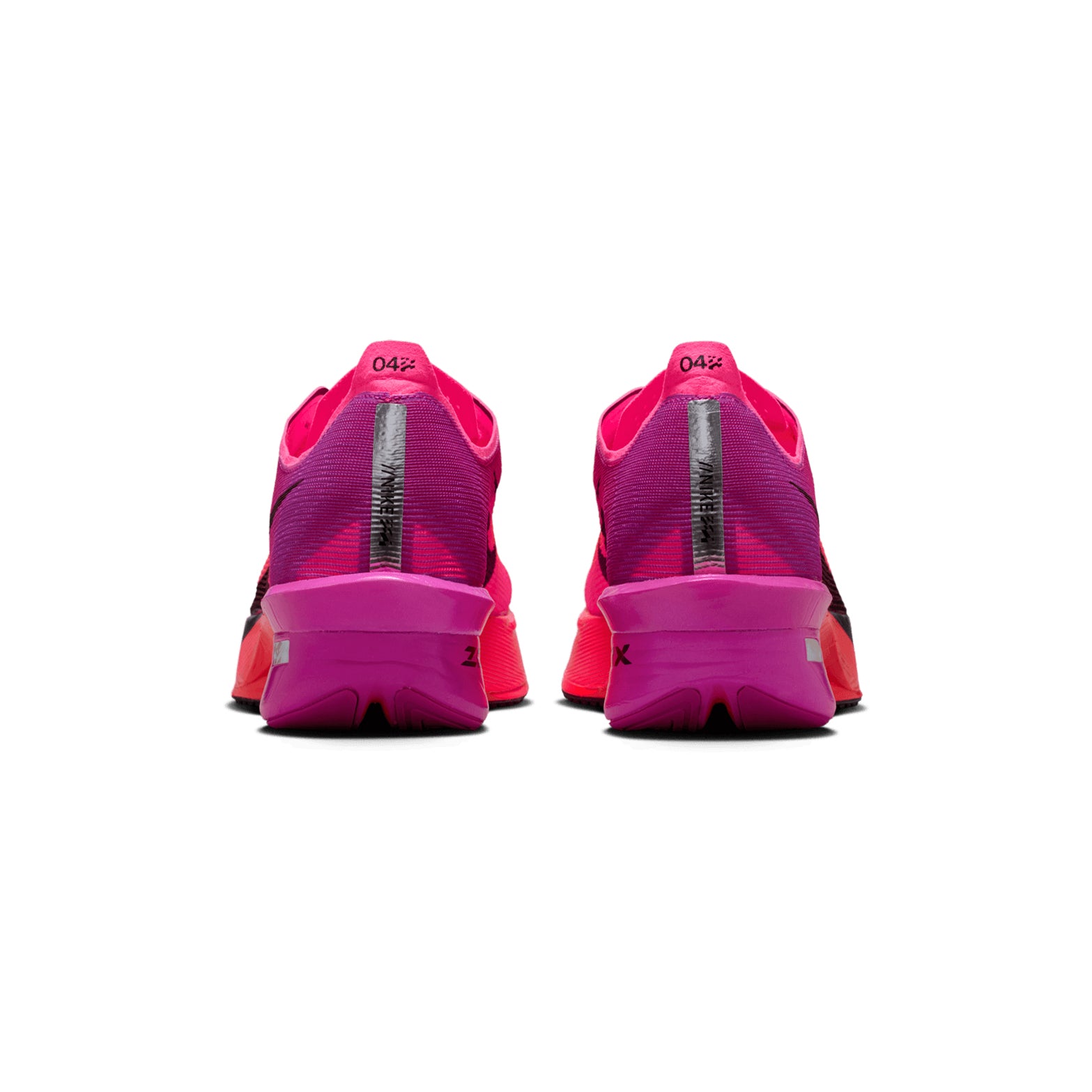 A pair of Nike Women’s Vaporfly 4 Running Shoes in Hyper Pink, Black, and Fuchsia Blast is displayed from the back against a white background. The heels feature bold black and white vertical stripes along with the number “04%,” while the shoes’ responsive carbon fibre plate design ensures optimal performance for runners.