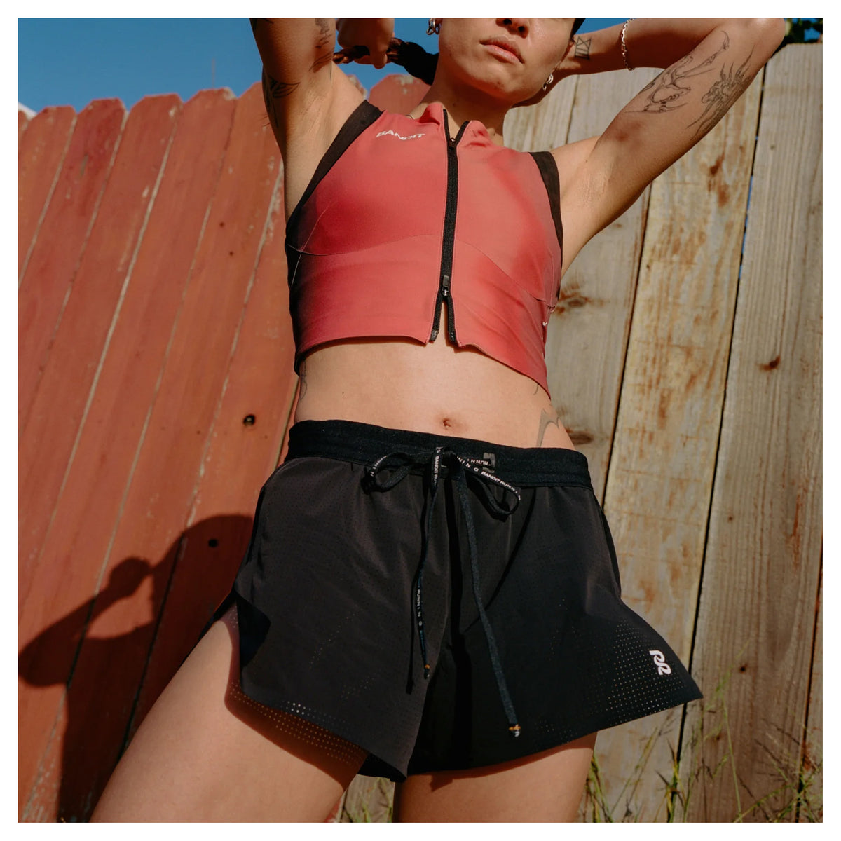 Bandit Vento™ Next Gen 3 Inch Split Shorts women's in Black — front view worn in motion showing bonded cutaway split in stride, Vento™ four-way stretch fabric and custom waistband with branded drawstring