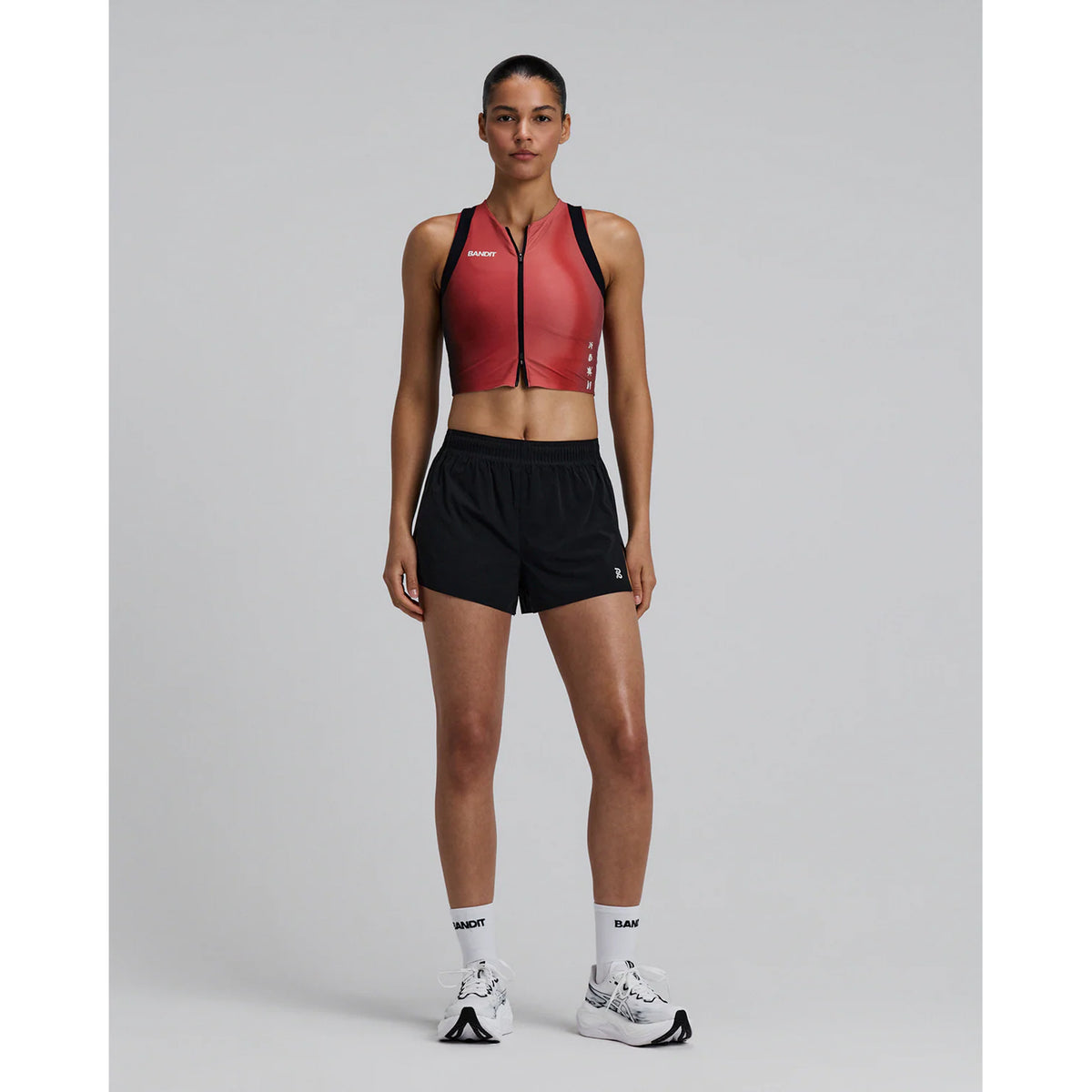 Bandit Vento™ Next Gen 3 Inch Split Shorts women's in Black — full body front view worn on model showing 3 inch split silhouette, custom waistband with branded drawstring and Vento™ four-way stretch fabric in motion
