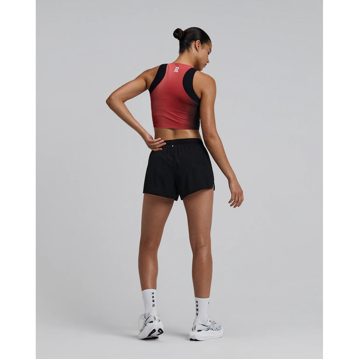 Bandit Vento™ Next Gen 3 Inch Split Shorts women's in Black — full body back view worn on model showing bonded cutaway split, gel pocket placement and Coolcore™ brief construction in motion