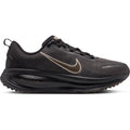 Women’s Vomero 18 Running Shoes in Medium Ash, Dark Hazel, Black, and Desert Khaki, featuring a metallic swoosh and a thick, ridged black midsole with dual-density cushioning.