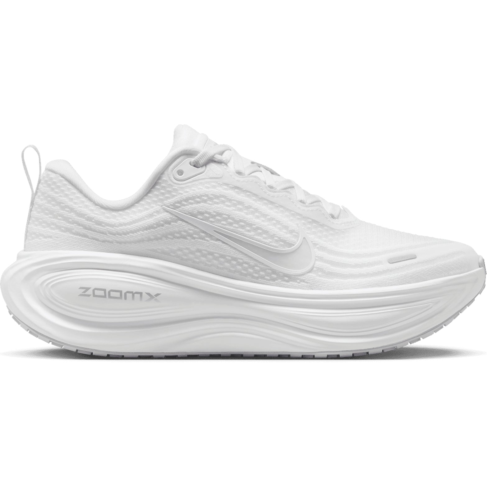 Nike Vomero Plus women's running shoe in White / Photon Dust / Metallic Silver / Summit White — outer view showing white engineered mesh upper with photon dust, metallic silver and summit white accent detailing and cushioning midsole profile