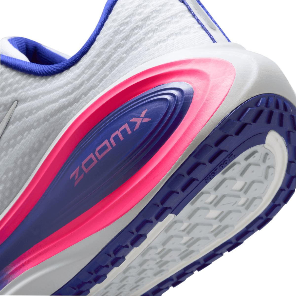 Nike Vomero Plus SE women's running shoe in White / Concord / Hyper Pink / Metallic Silver — angled side view showing white engineered mesh upper, hyper pink and metallic silver accent detailing and maximal full-length ZoomX foam midsole stack with concord contrast