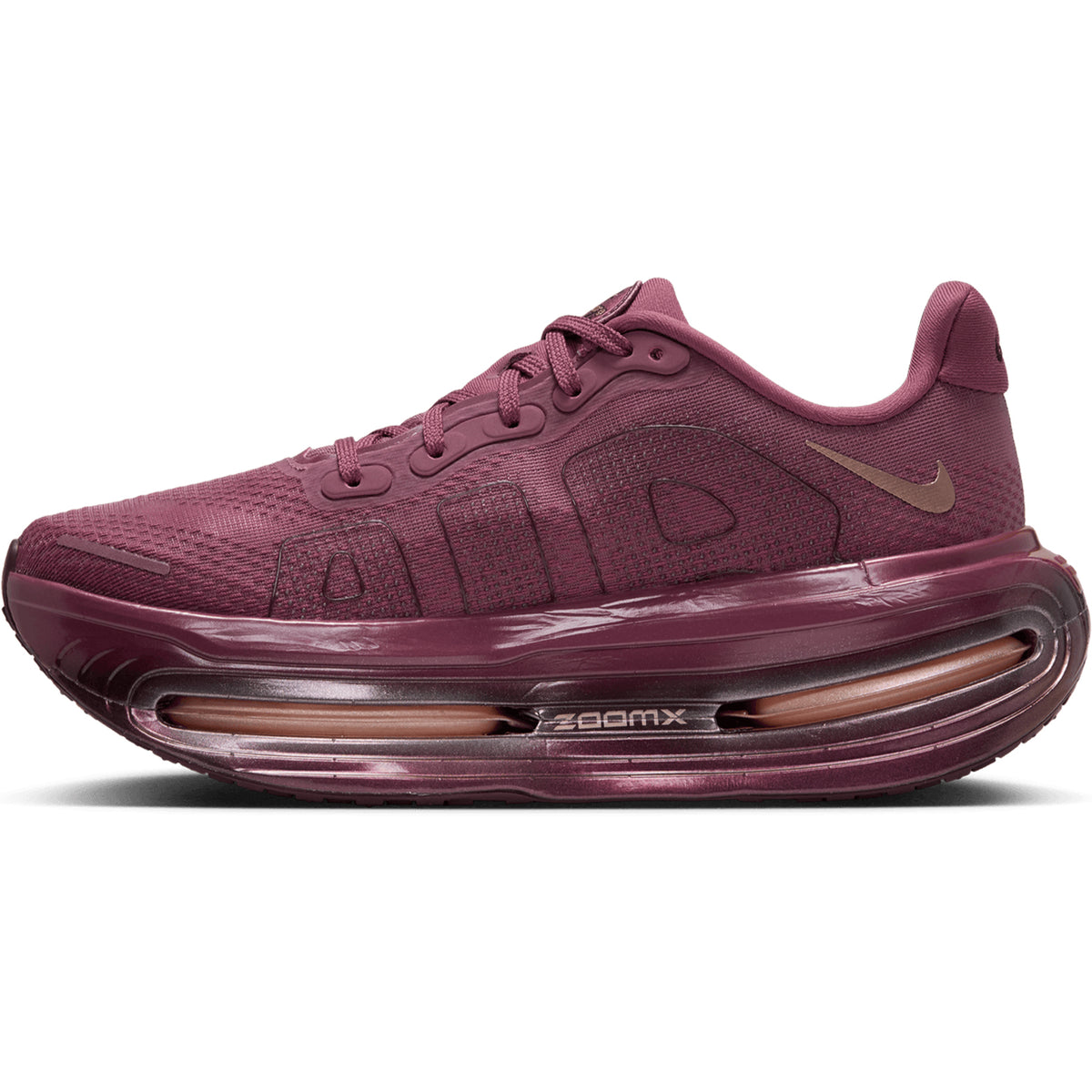 Women’s Vomero Premium GG Running Shoes in Pink Smoke / Mystic Dates, featuring a thick, sculpted sole with ZoomX cushioning and a prominent cutout in the midsole.