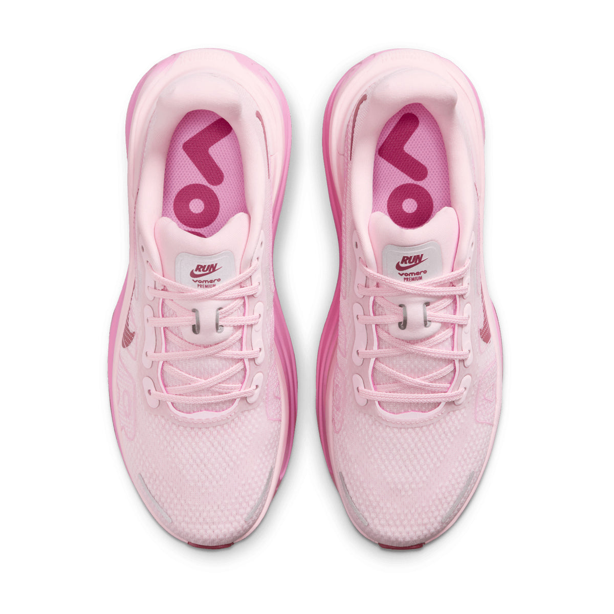 Nike Vomero Premium women's running shoe in Pink Foam / Pink Rise / Light Magenta / Pink Smoke — top-down view showing pink foam engineered mesh upper construction, lace closure and pink rise, light magenta and pink smoke accent detailing