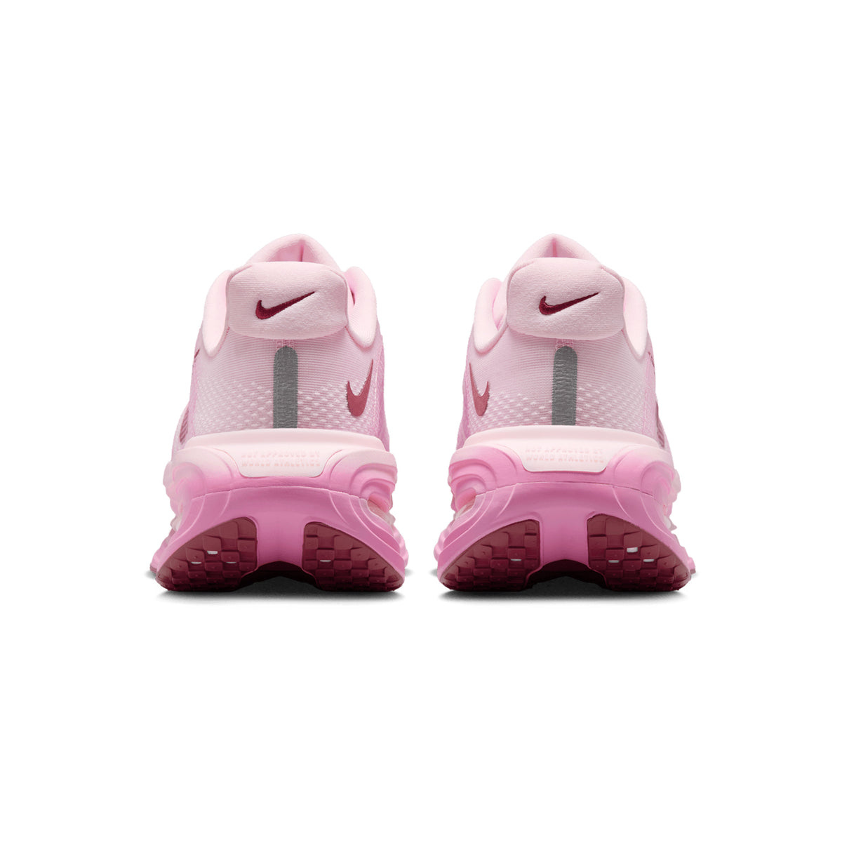 Nike Vomero Premium women's running shoe in Pink Foam / Pink Rise / Light Magenta / Pink Smoke — heel view showing structured support construction, light magenta heel detailing and pink rise cushioning midsole contrast