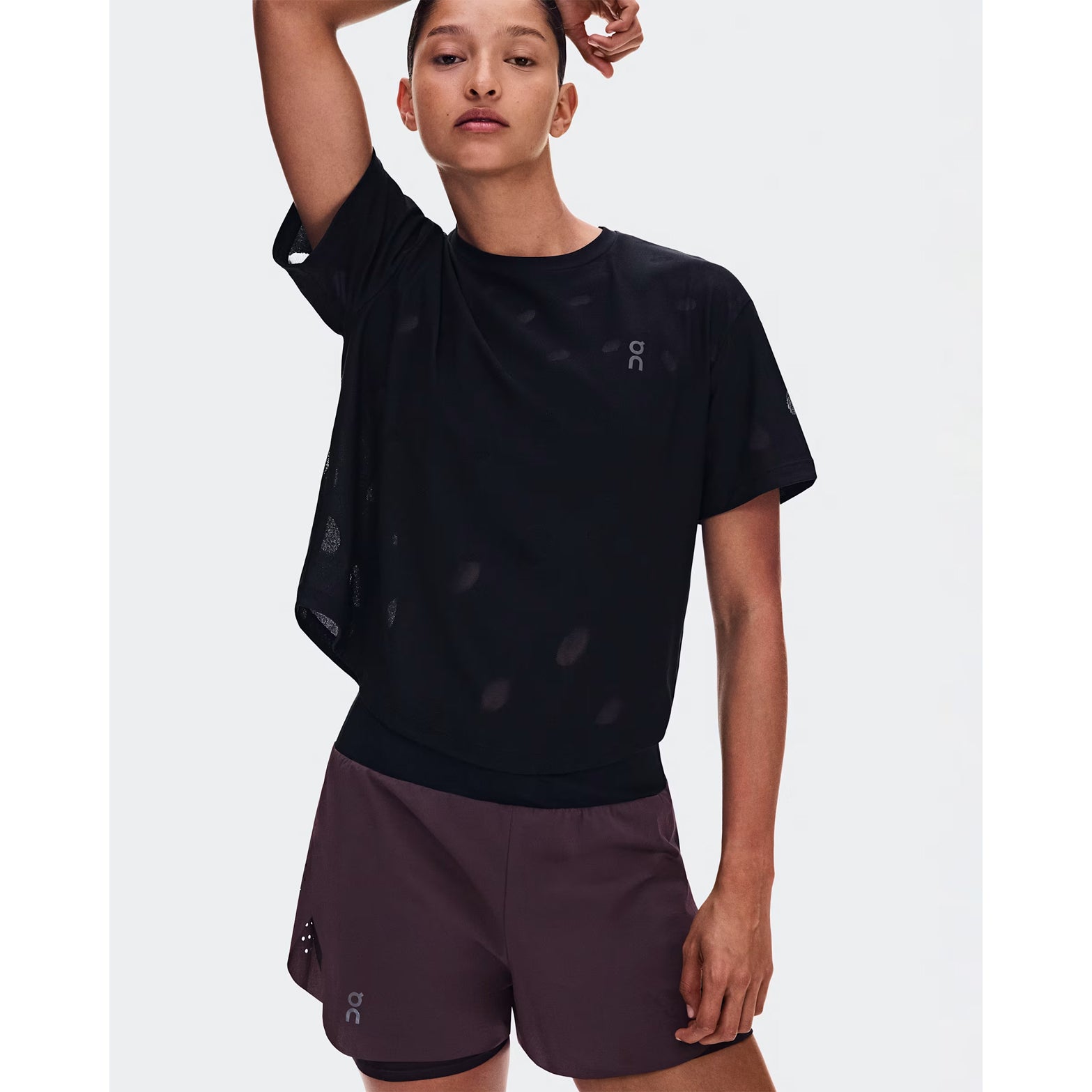 Women's On Zero-T Breathe Black front view on female runner showing ultralight DryTec breathable jacquard construction with distraction-free fit for training runs