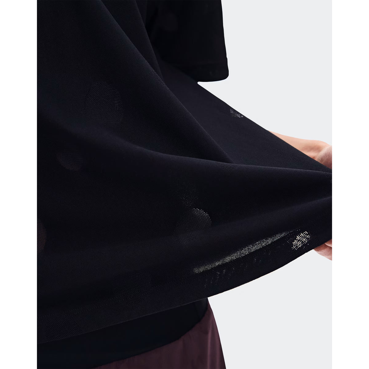 Women's On Zero-T Breathe Black close-up of distinctive functional jacquard fabric showing On DryTec breathable moisture-wicking construction for ultralight distraction-free training