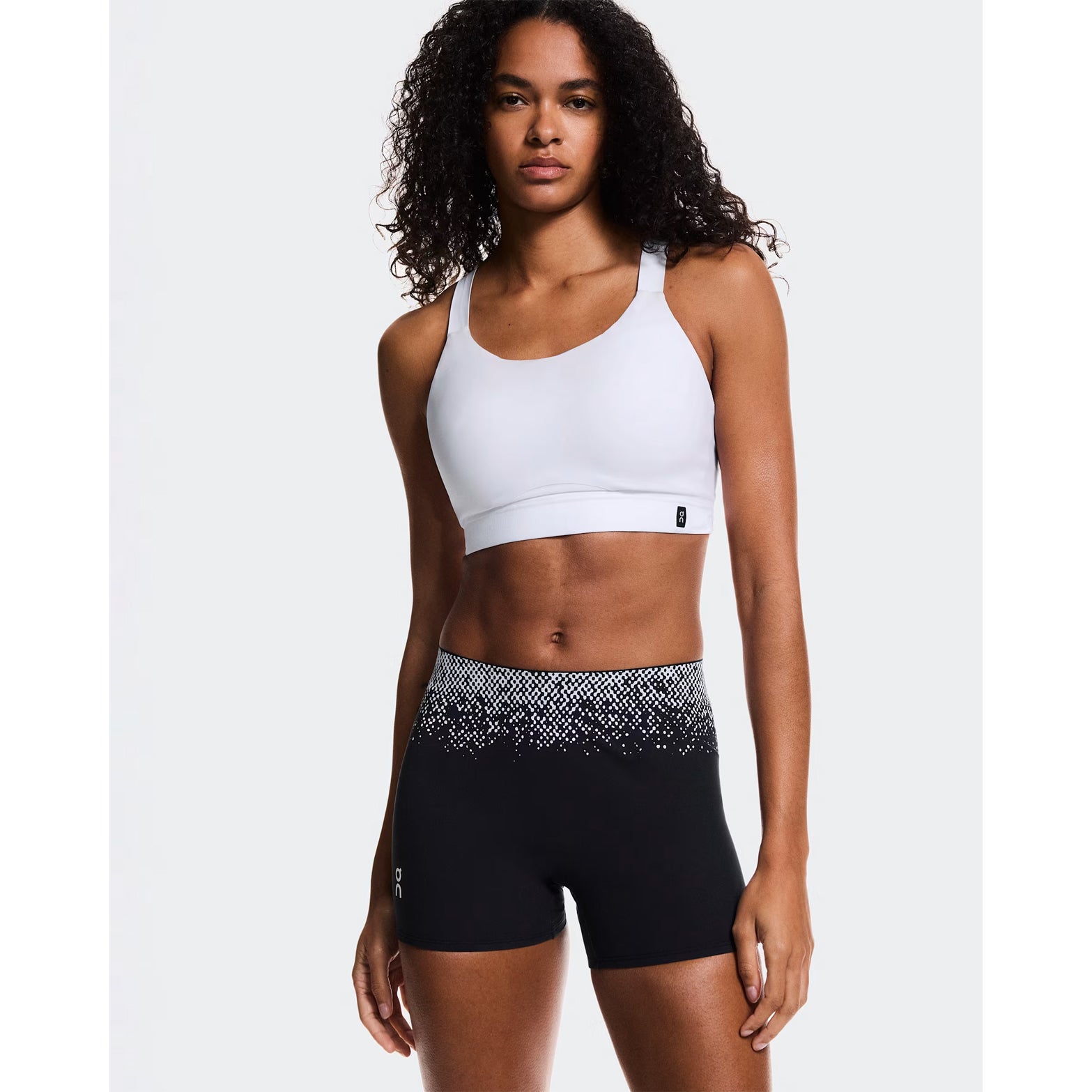 Women's On Zero Short Tights Black White front view on female runner showing engineered premium waistband construction and race-ready fit