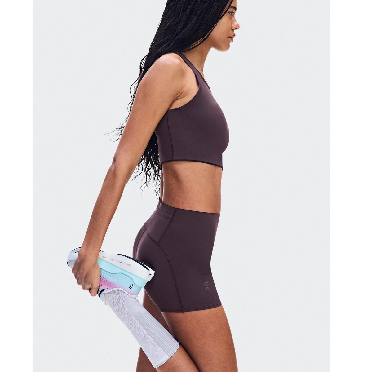 Women's On Zero Short Tights Urchin side view on female runner showing lightweight technical fabric with premium waistband and back pocket for confident secure race day performance