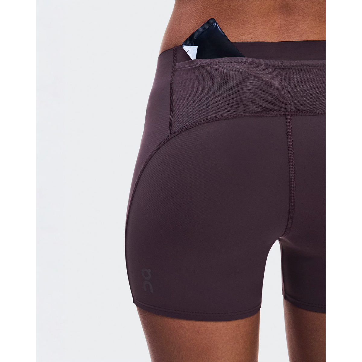 Women's On Zero Short Tights Urchin close-up of back pocket showing accessible gel storage with lightweight construction for practical race day nutrition without additional belts