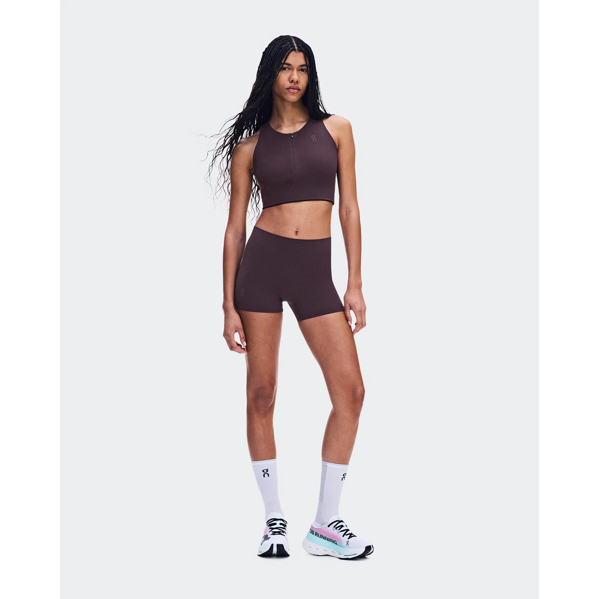 Women's On Zero Short Tights Urchin front full body view on female runner showing expressive On athlete-inspired graphic with lightweight moisture-wicking construction for race day and fast training efforts