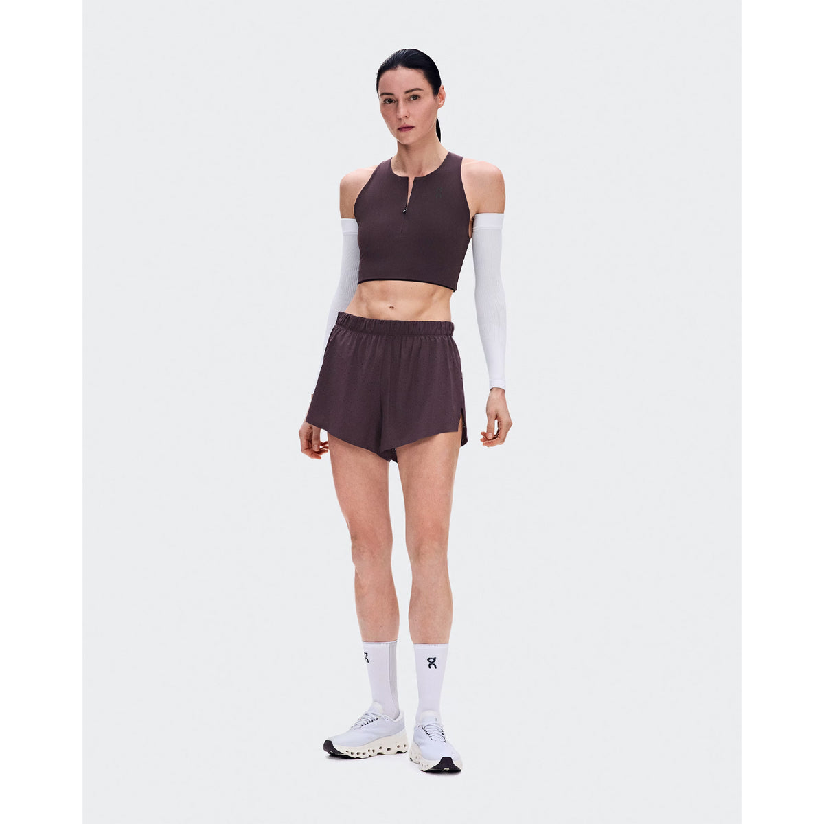 Women's On Zero Shorts Urchin front full body view on female runner showing On athlete-inspired graphic with lightweight perforated construction and adjustable waistband for race day and fast training