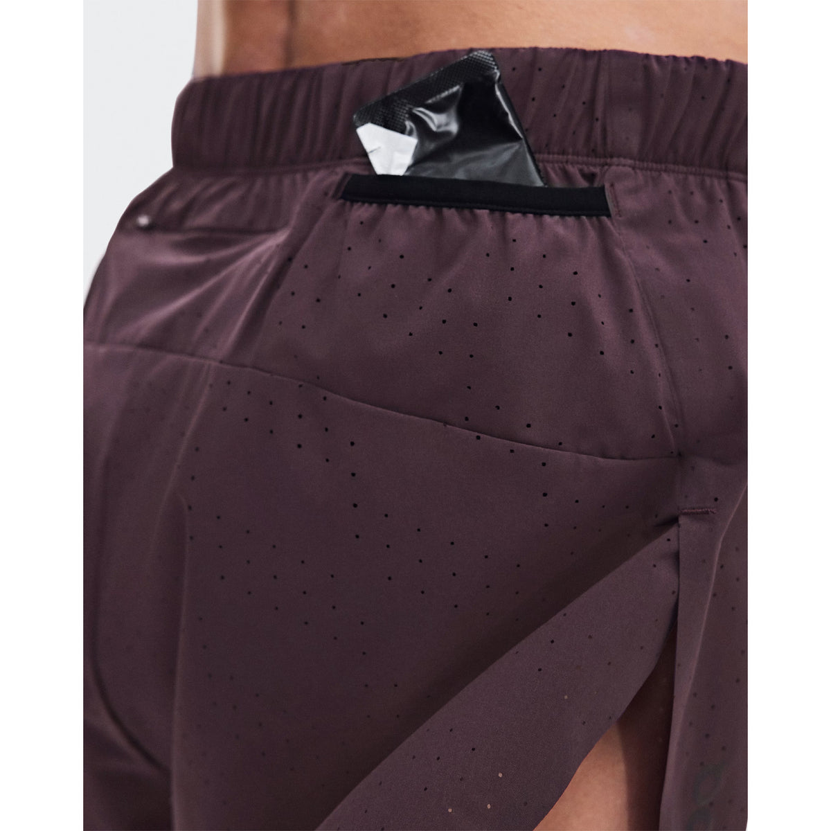 Women's On Zero Shorts Urchin close-up of back showing zip pocket and two gel mesh pockets for accessible race day storage without additional belts or carrying solutions