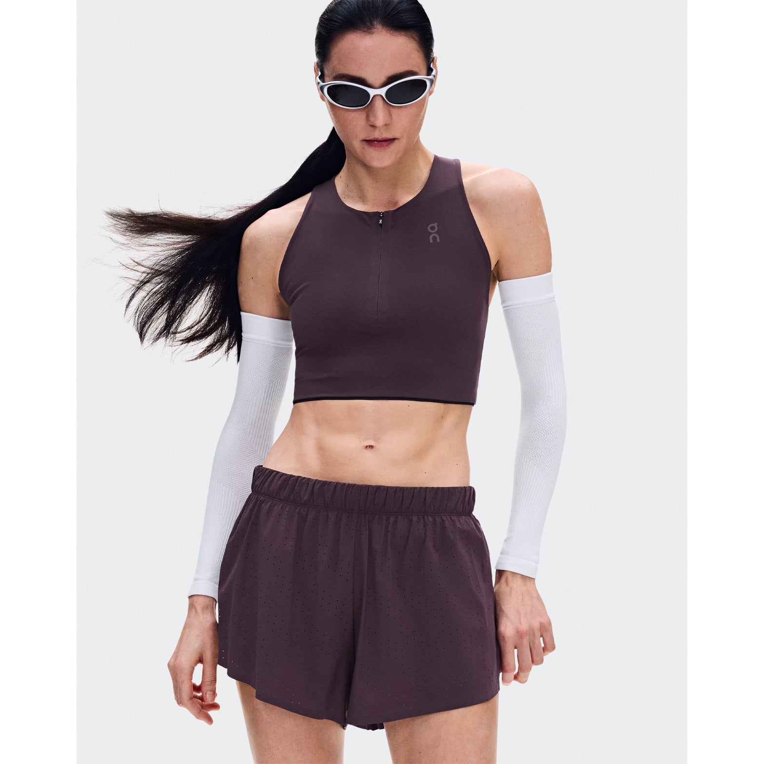 Women's On Zero Shorts Urchin front view on female runner showing lightweight perforated outer with On athlete-inspired graphic and adjustable waistband for race day performance