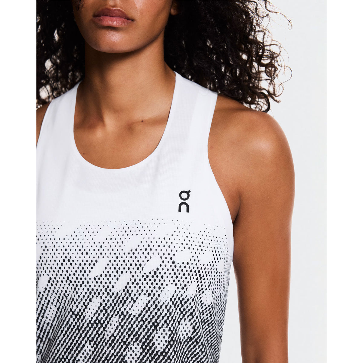 Women's On Zero Singlet White Black Grey close-up front view showing On DryTec technical fabric, expressive graphic and ultra-lightweight construction
