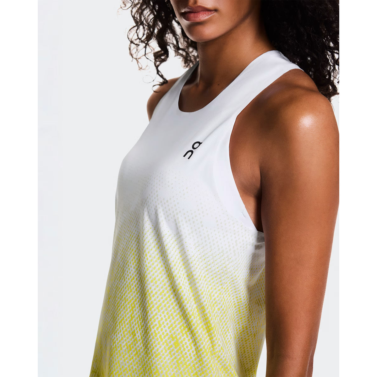 Women's On Zero Singlet White Yellow close-up front view showing On DryTec technical fabric, expressive graphic and ultra-lightweight construction