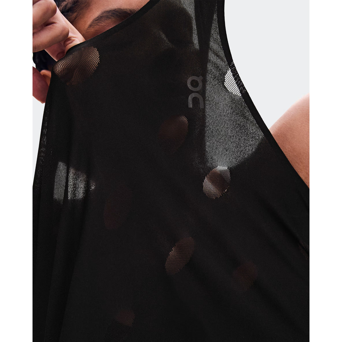 Women's On Zero Tank Breathe Black close-up of striking functional jacquard fabric showing On DryTec breathable moisture-wicking construction with minimal seams for ultralight distraction-free racing and training