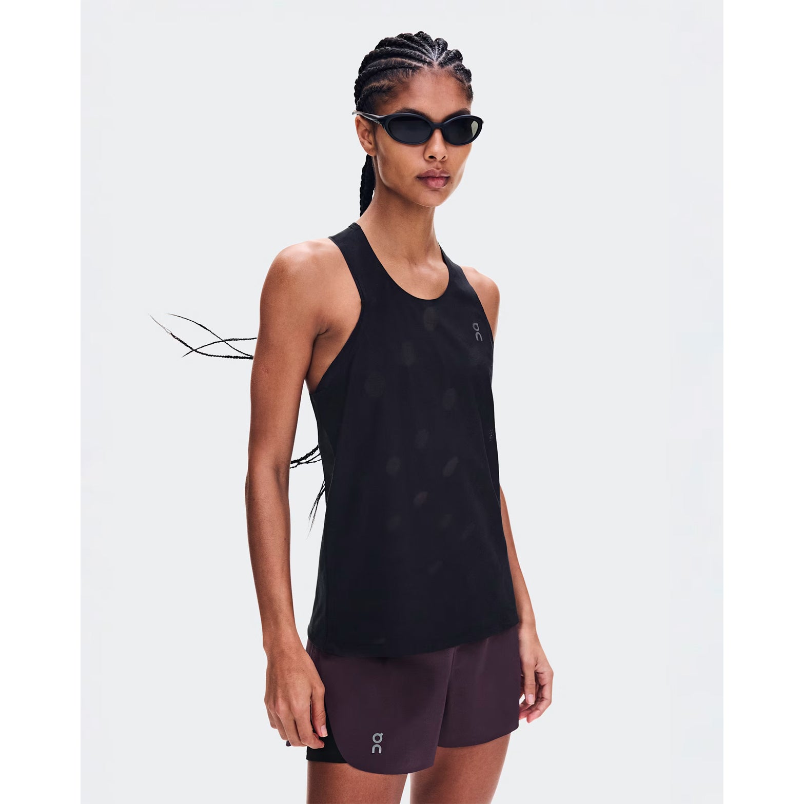 Women's On Zero Tank Breathe Black front view on female runner showing ultralight DryTec breathable jacquard construction with minimalist distraction-free fit for fast training