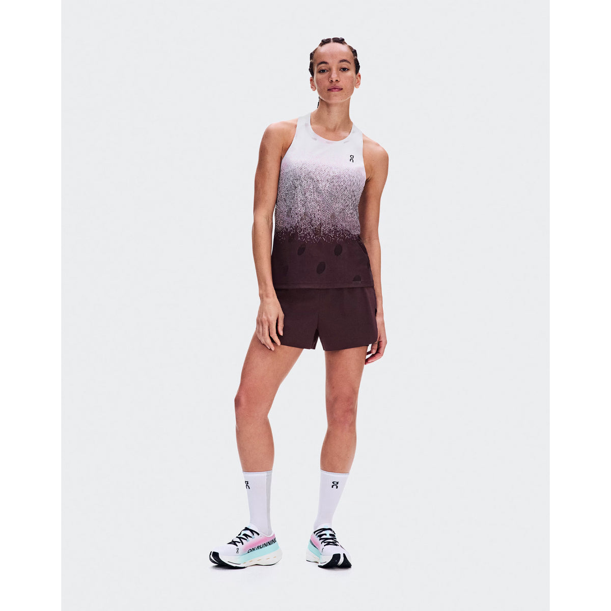 Women's On Zero Tank Breathe Foxglove White front full body view on female runner showing ultralight OAC-inspired jacquard tank with DryTec breathable construction for race day and fast training performance