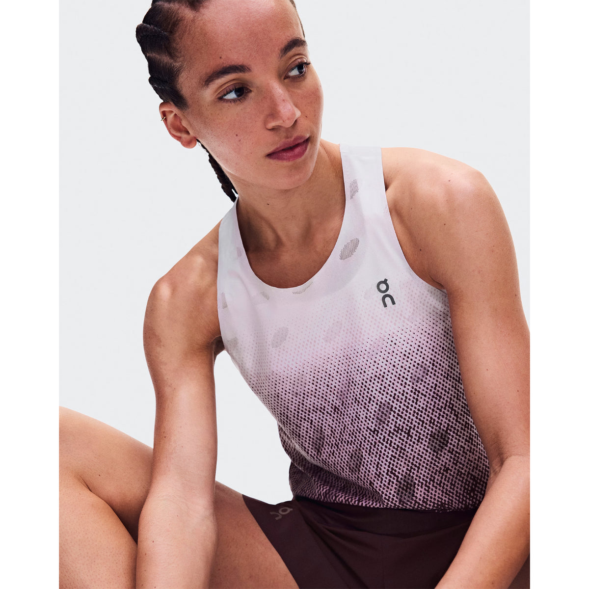 Women's On Zero Tank Breathe Foxglove White close-up of front showing striking functional jacquard fabric with On DryTec breathable moisture-wicking construction and minimalist distraction-free design for fast training and race day