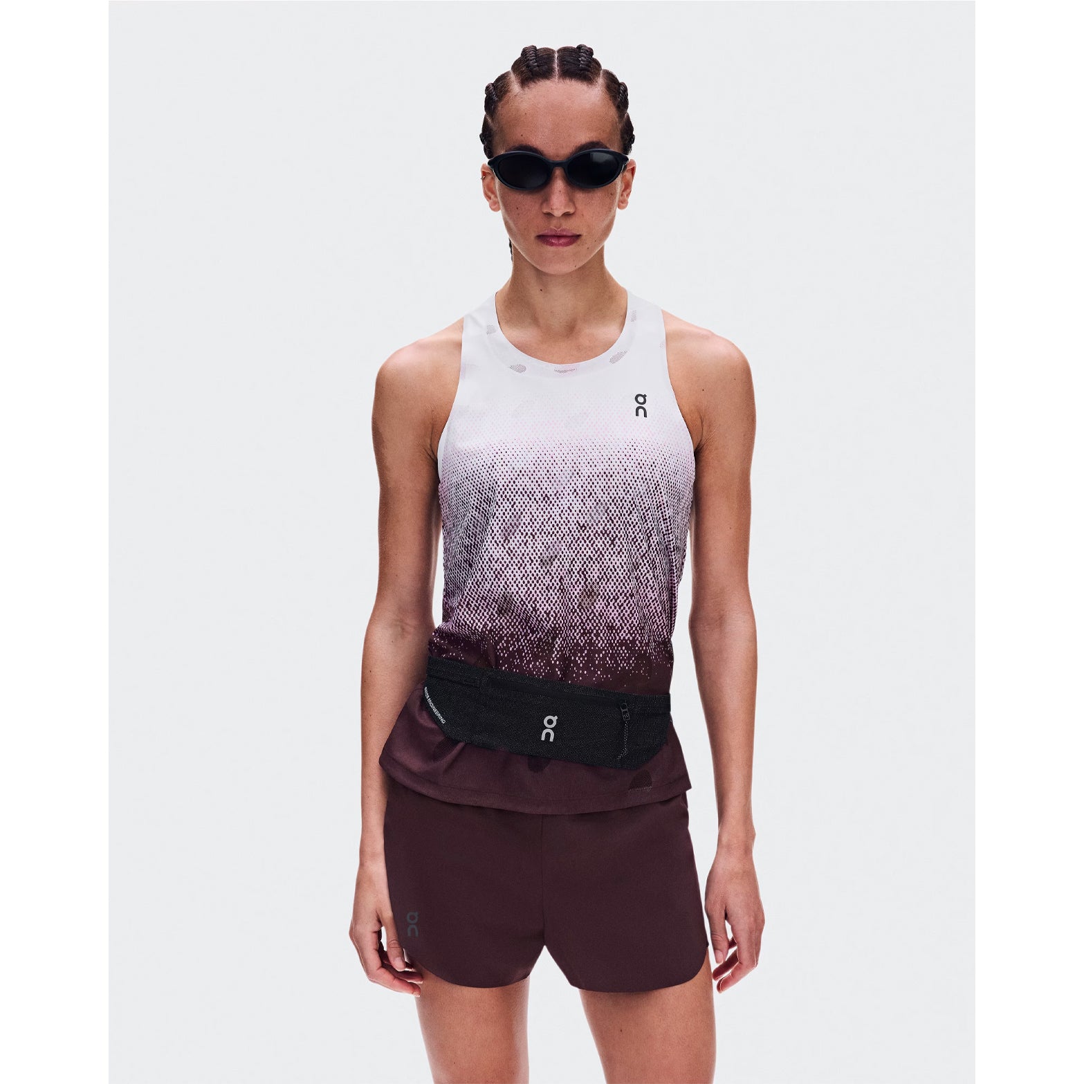 Women's On Zero Tank Breathe Foxglove White front view on female runner showing ultralight DryTec breathable jacquard construction with minimalist distraction-free fit for fast training