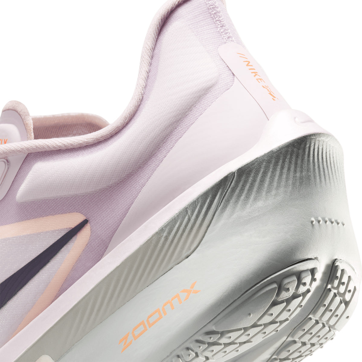 Nike Zoom Fly 6 women's running shoe in Bleached Lilac / Purple Dynasty / Volt Tint — angled side view showing bleached lilac engineered mesh upper, responsive cushioning design and purple dynasty Zoom foam midsole stack with carbon plate propulsion