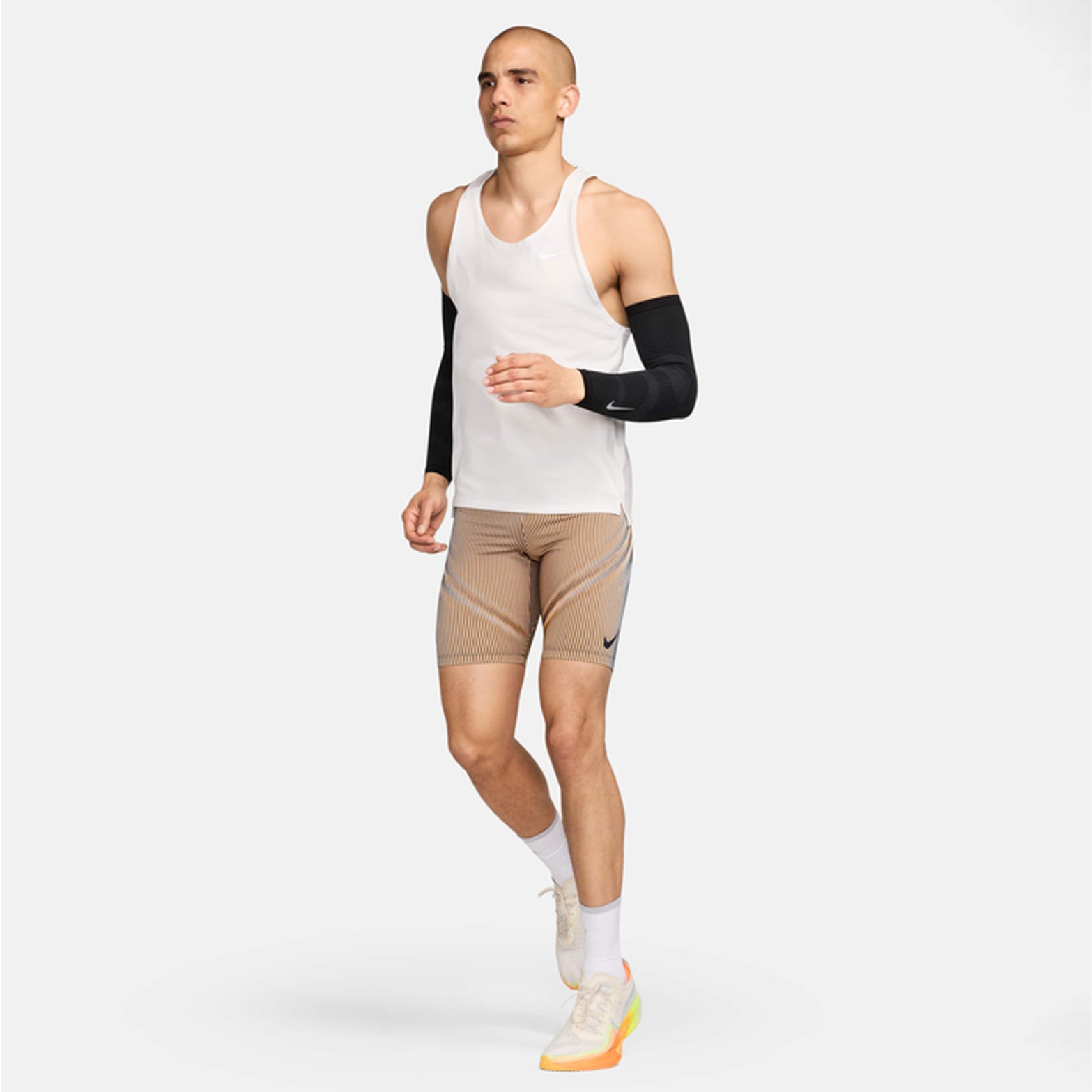 Nike Zoned Arm Sleeves in Black / Dark Smoke Grey / Silver — full body front view worn on model showing black dual-knit arm sleeves with dark smoke grey and silver zoned detailing in running position