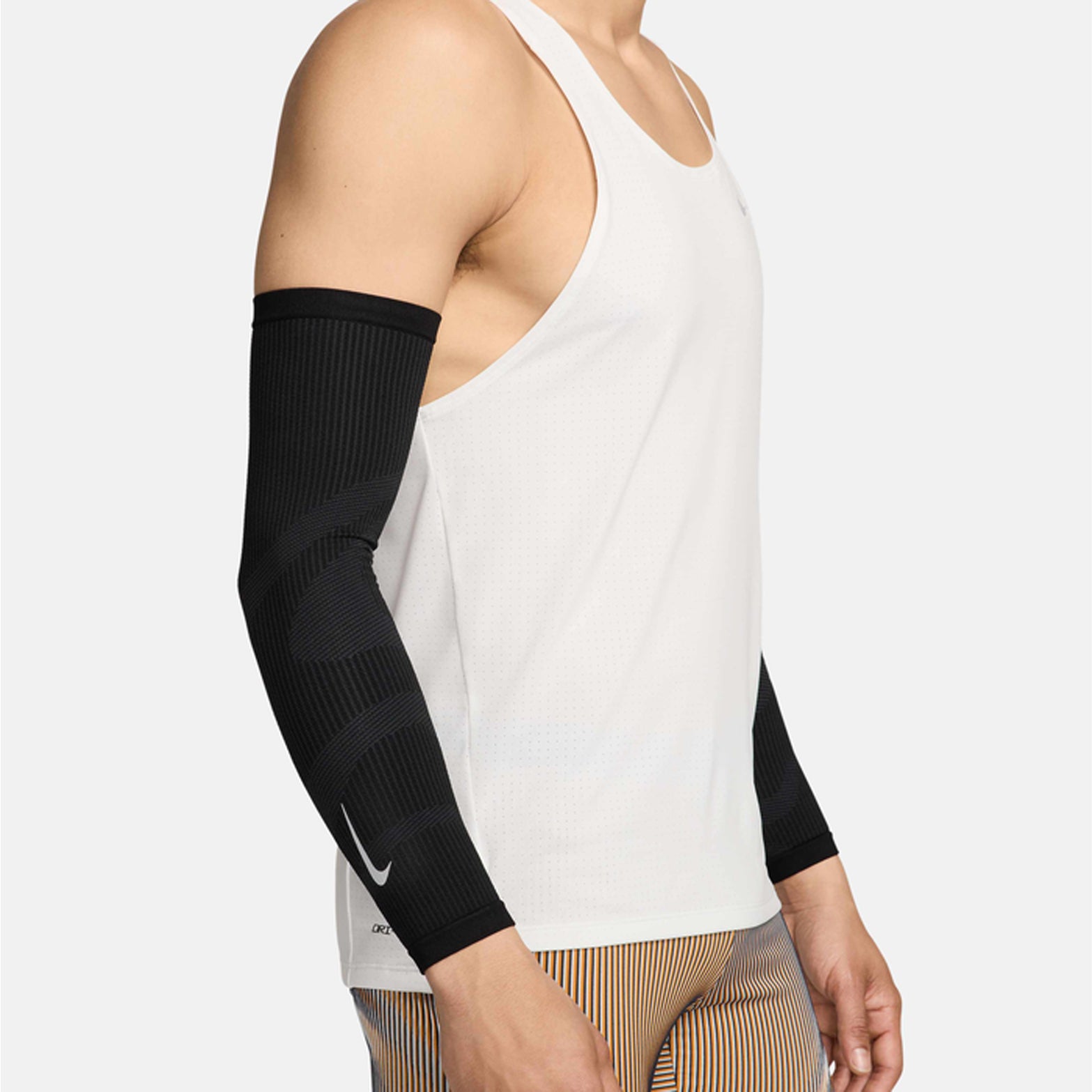 Nike Zoned Arm Sleeves in Black / Dark Smoke Grey / Silver — side view showing black dual-knit zoned design with breathable mesh zones and dark smoke grey and silver accent detailing on seamless construction