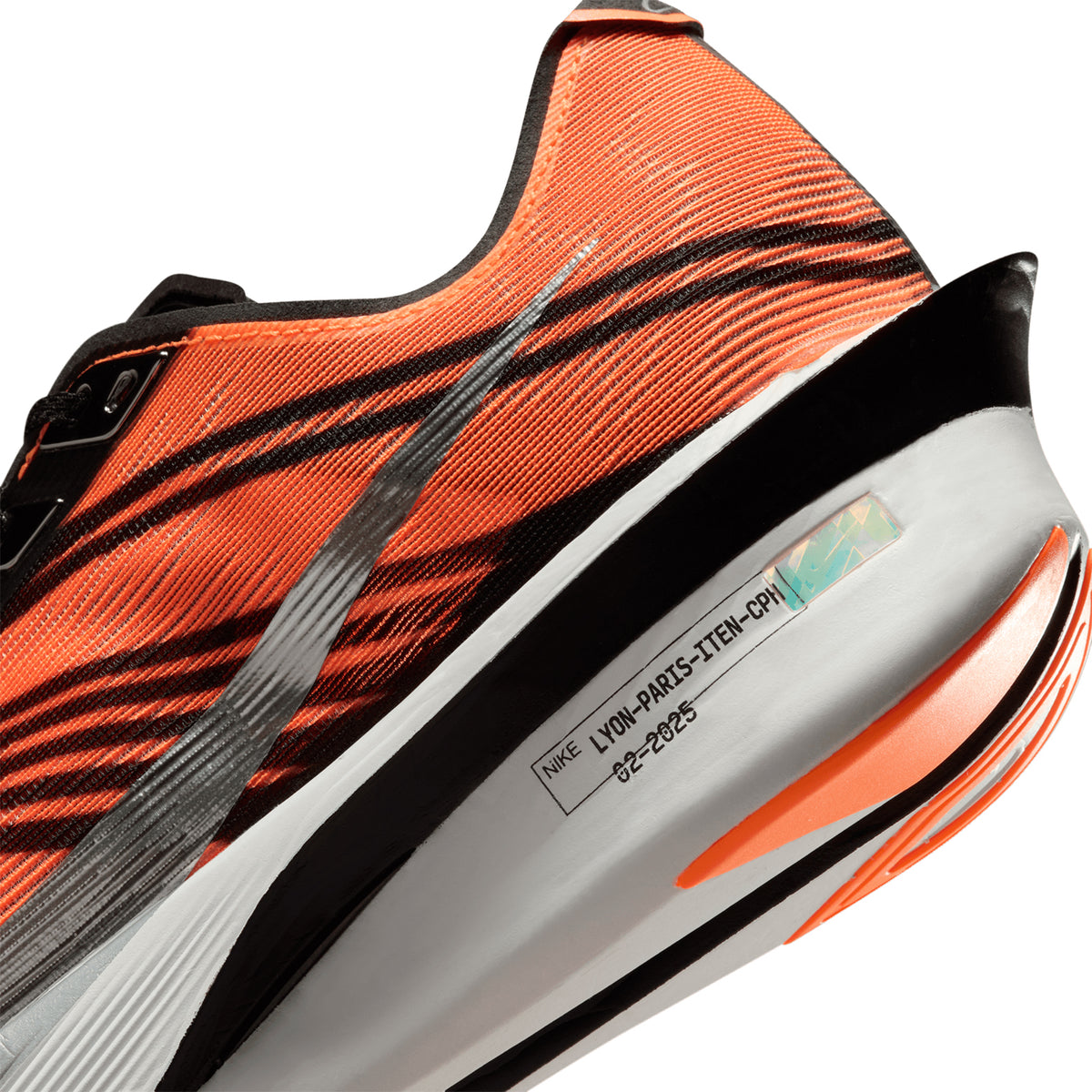 Men's Nike x DISTANCE Vaporfly 4 Running Shoes Total Orange Black White Metallic Silver angled side and heel view showing full-length carbon Flyplate with optimised ZoomX foam and DISTANCE collaboration design for lightweight propulsive elite race day performance