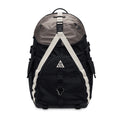 Introducing the Nike ACG Daymax 25L Backpack in Black and College Grey. This versatile backpack features white straps, a mesh front pocket, and the iconic ACG logo on the front. With convenient side pockets and a durable top handle, it’s designed for both everyday use and outdoor adventures.