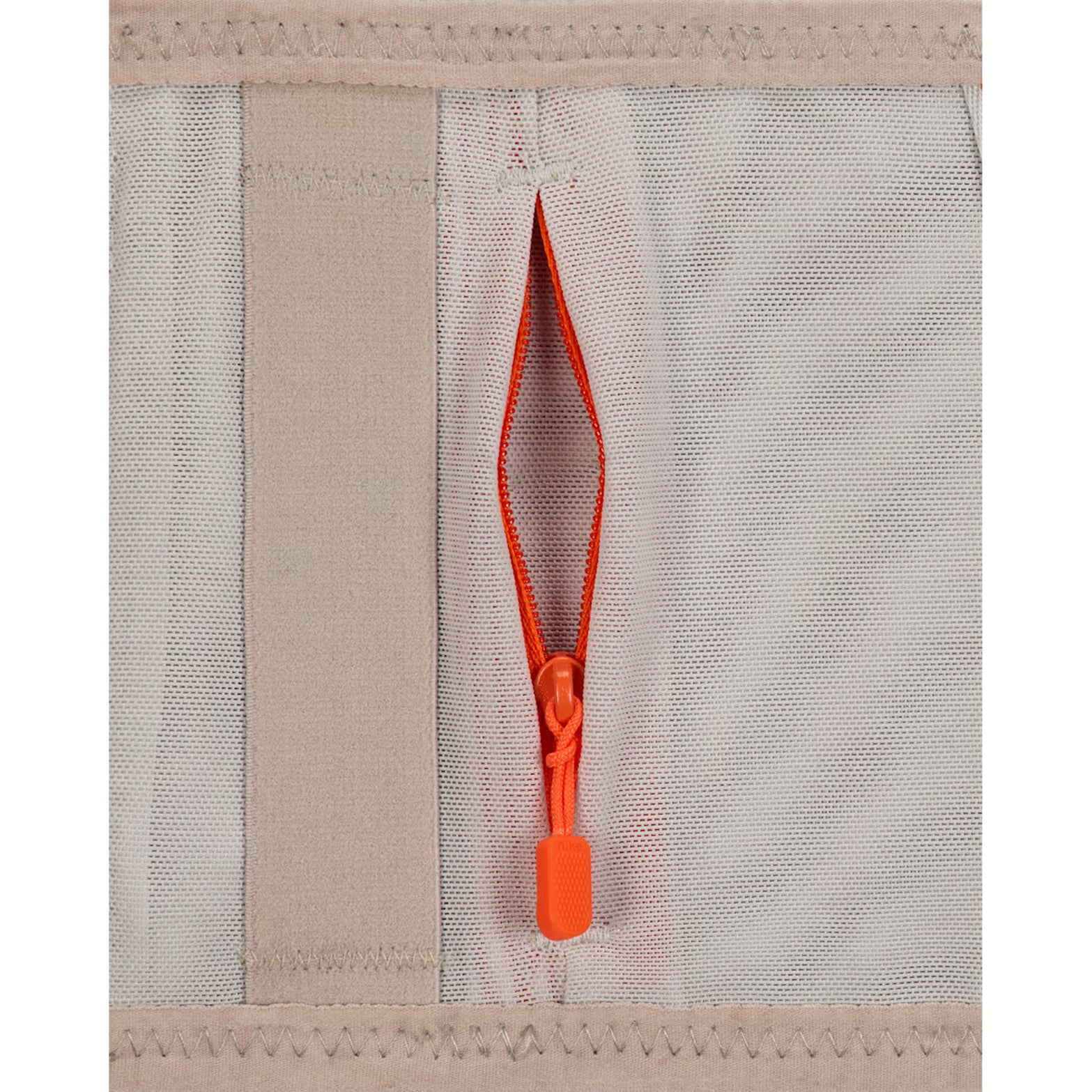 Nike ACG Goat Belt in Grey Fog / Safety Orange / Summit White — closeup showing removable bungee system zip storage detail on grey fog recycled polyester with safety orange and summit white accent piping