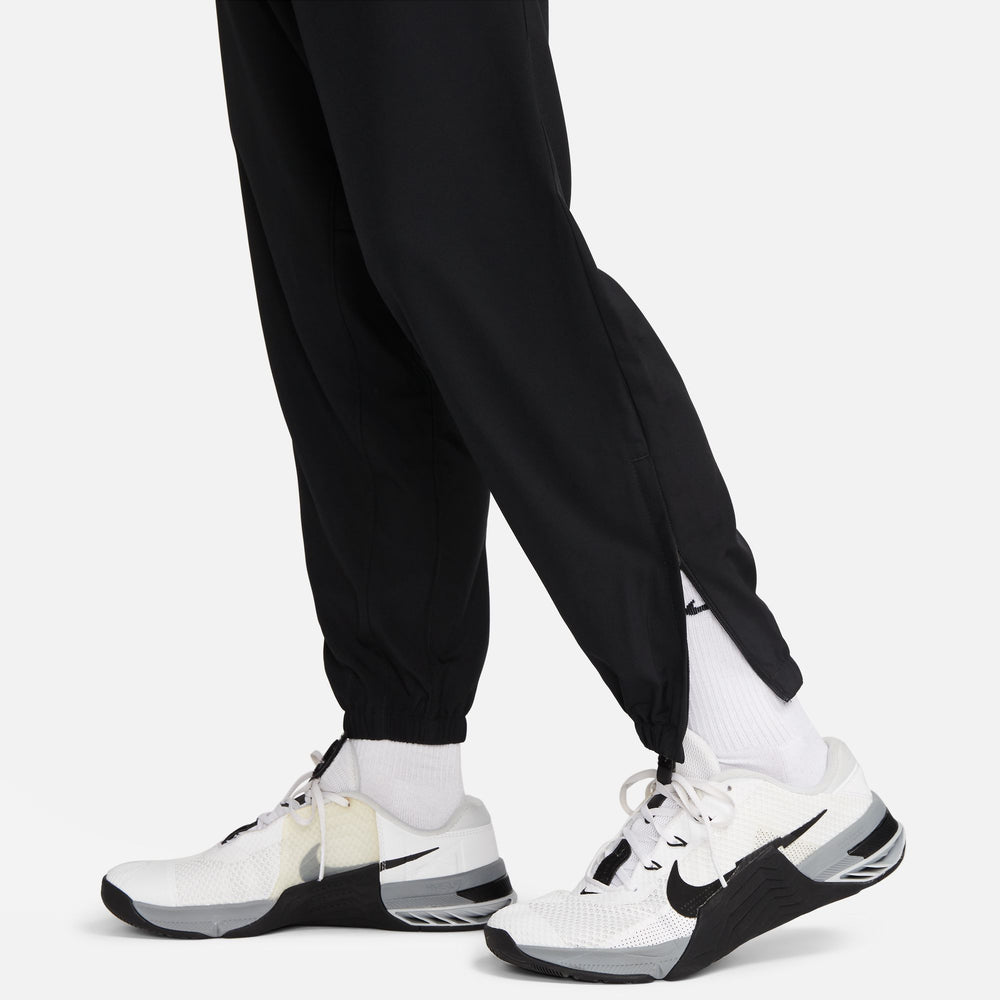 Nike Men's Dri-FIT Tapered Versatile Trousers Black / Black - achilles heel