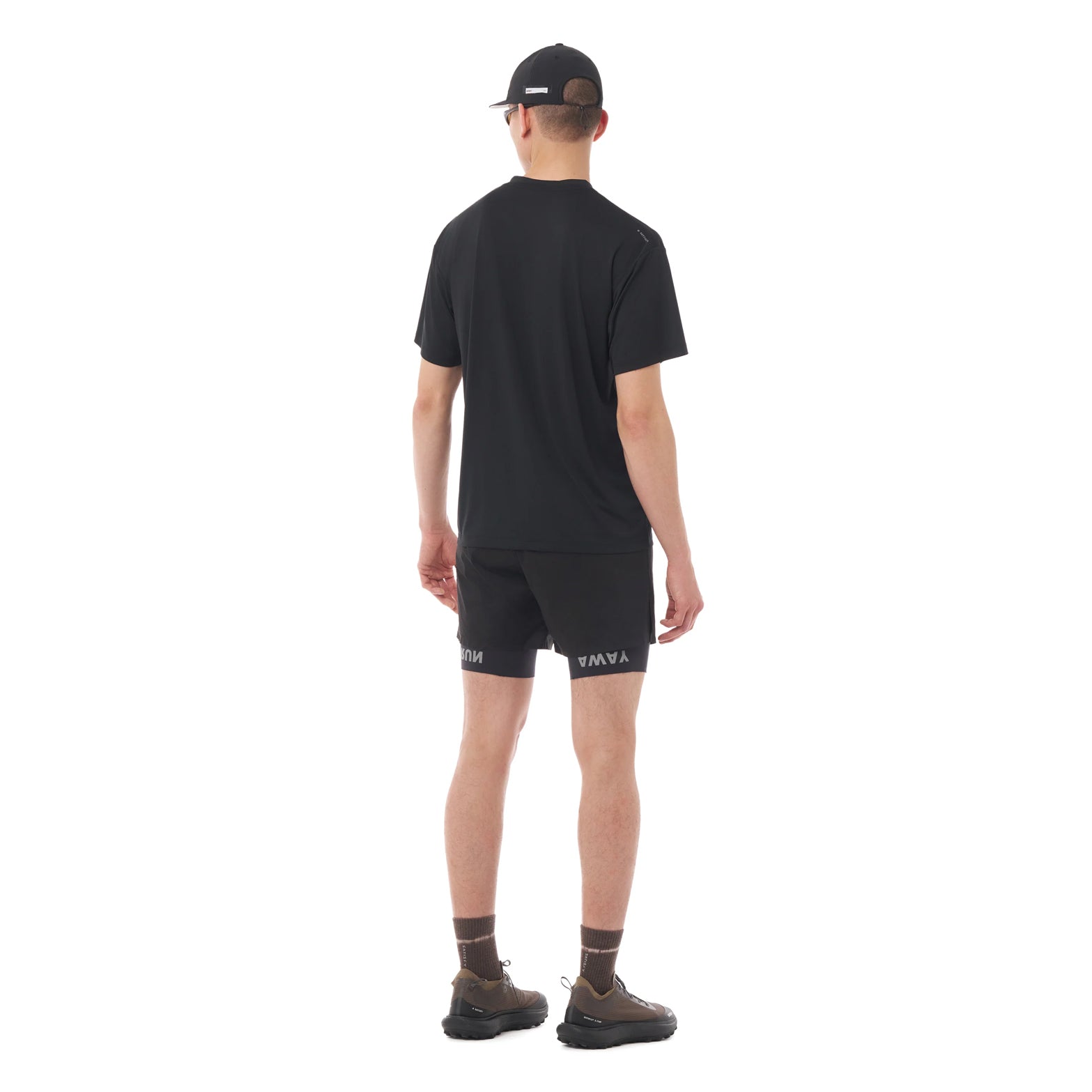 Satisfy AuraLite Tee Black full body back view on male runner showing moisture control fabric with stealth-reflective logo for low-light visibility